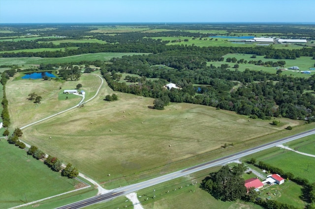 bird's eye view featuring a water view and a rural view