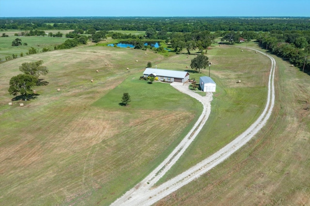 birds eye view of property with a water view and a rural view