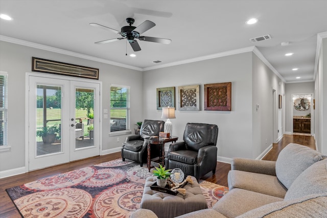 living room featuring ceiling fan, dark hardwood / wood-style floors, french doors, and crown molding