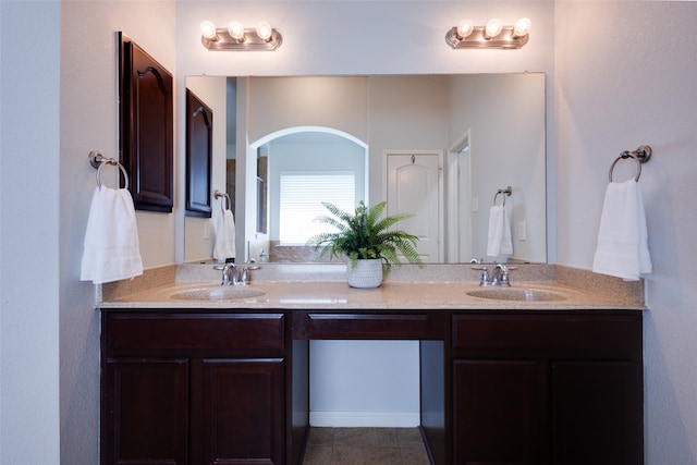 bathroom with tile patterned floors and vanity