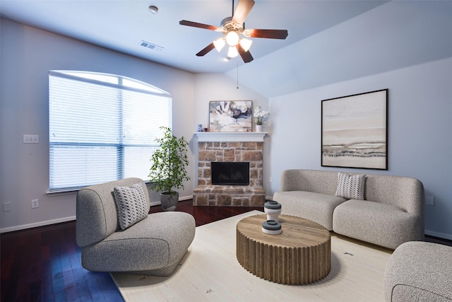 living room with plenty of natural light, wood-type flooring, and vaulted ceiling