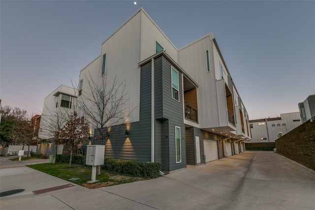 outdoor building at dusk with a garage