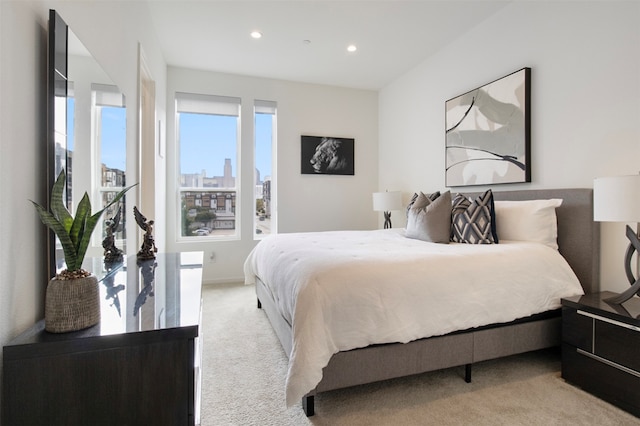 bedroom featuring light colored carpet