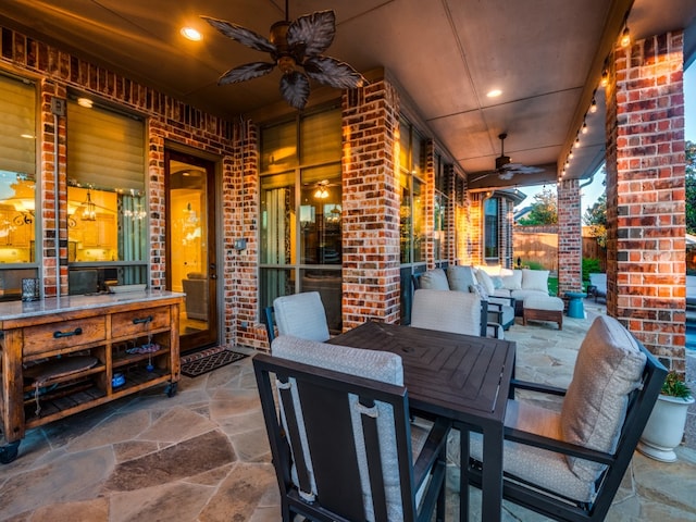 view of patio with an outdoor living space and ceiling fan