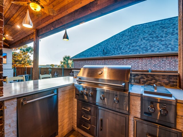 view of patio with area for grilling and ceiling fan