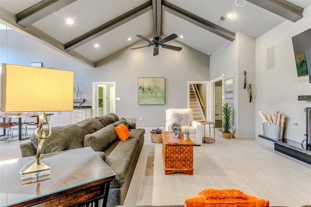 living room with high vaulted ceiling, beam ceiling, and ceiling fan