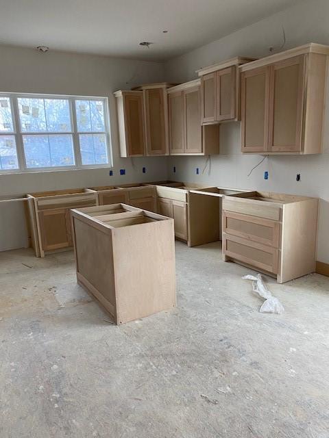 kitchen with light brown cabinetry