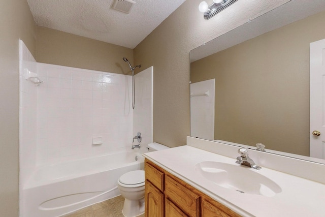 full bathroom with a textured ceiling, shower / bath combination, vanity, and toilet