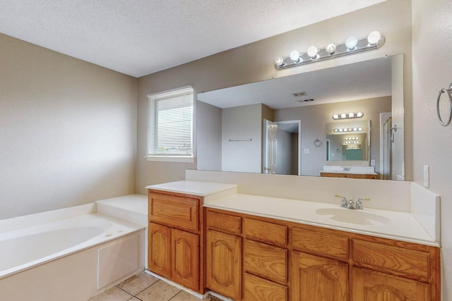 bathroom featuring a textured ceiling, independent shower and bath, vanity, and tile patterned floors