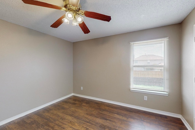 spare room featuring ceiling fan, a textured ceiling, and dark hardwood / wood-style floors