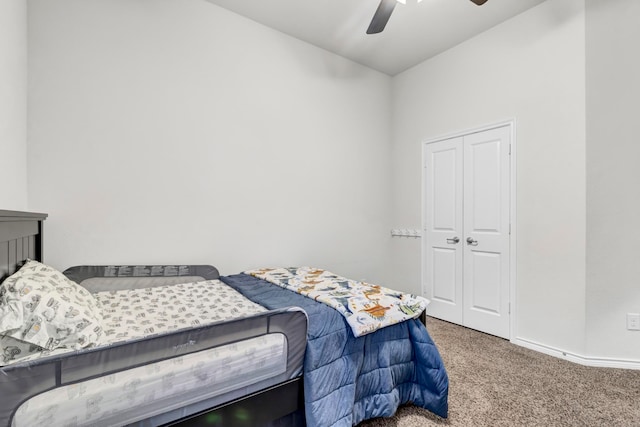 bedroom with carpet flooring, a closet, and ceiling fan