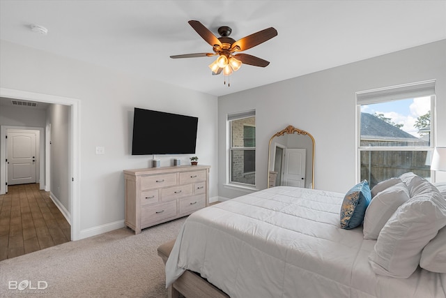 carpeted bedroom featuring ceiling fan