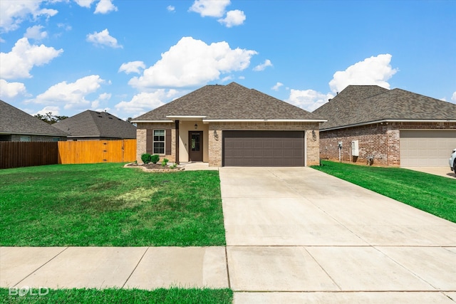 prairie-style home featuring a front yard and a garage