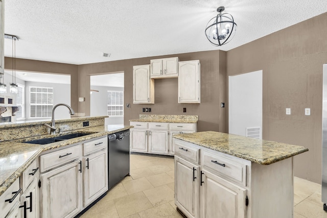 kitchen with hanging light fixtures, a center island, dishwasher, and sink