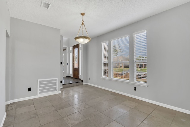 interior space with a textured ceiling