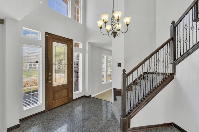 entrance foyer with a chandelier and a high ceiling