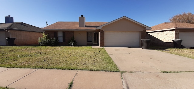 single story home featuring a garage and a front yard