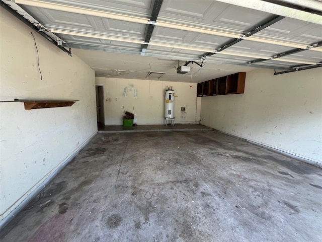 garage featuring a garage door opener and water heater