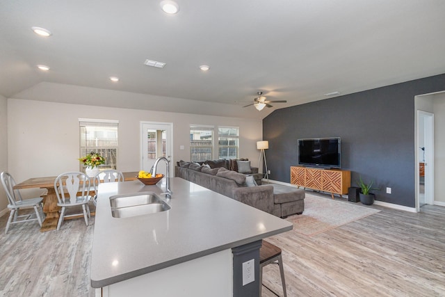 641 Fletcher Dr, Fate, TX 75087 - living area featuring light wood-style floors, a ceiling fan, and baseboards