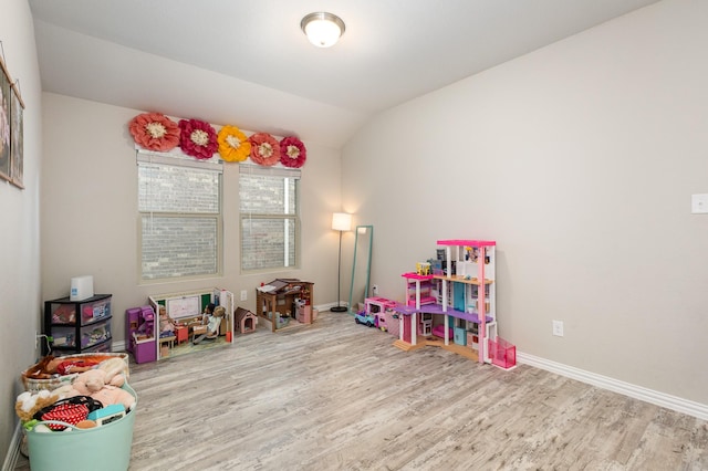 641 Fletcher Dr, Fate, TX 75087 - playroom with wood finished floors, lofted ceiling, and baseboards