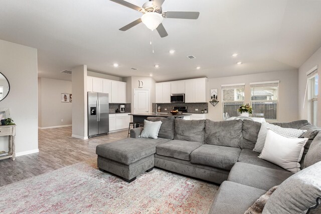641 Fletcher Dr, Fate, TX 75087 - living room featuring recessed lighting, visible vents, baseboards, light wood-style flooring, and ceiling fan