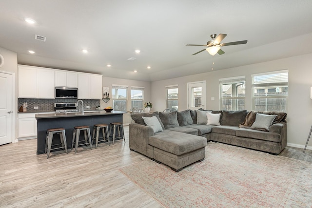 641 Fletcher Dr, Fate, TX 75087 - living area featuring light wood-type flooring, a ceiling fan, visible vents, and recessed lighting