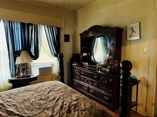 bedroom with wooden walls