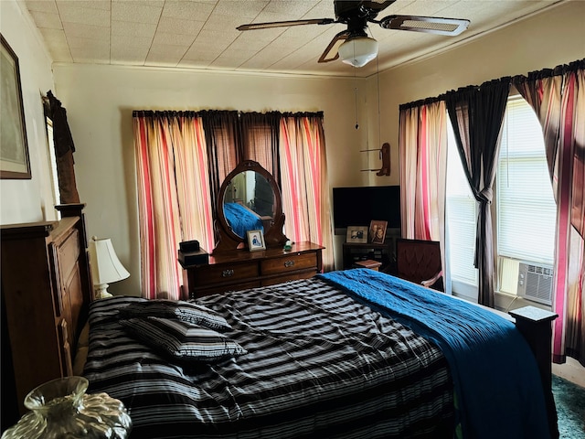 bedroom featuring crown molding and ceiling fan