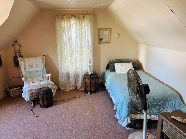 bedroom featuring carpet and lofted ceiling