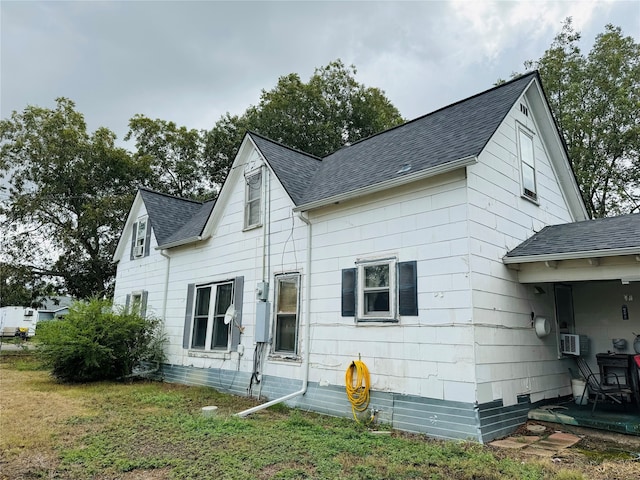 back of house with a yard