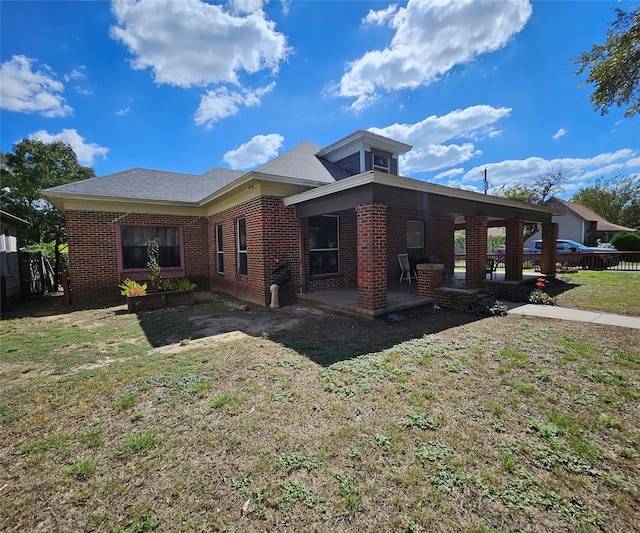 view of home's exterior with a yard and a patio