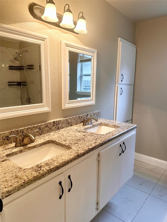 bathroom with vanity and a tile shower