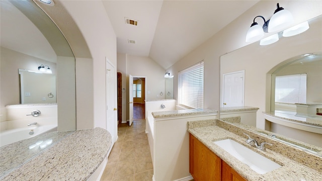 bathroom with vanity, lofted ceiling, a notable chandelier, and tile patterned floors