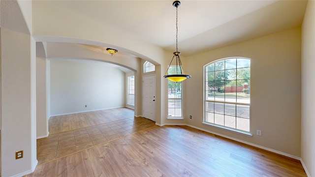 spare room featuring light hardwood / wood-style flooring