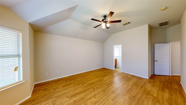 interior space with light wood-type flooring, ceiling fan, and plenty of natural light