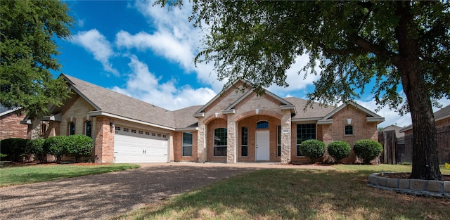 view of front facade featuring a front lawn and a garage