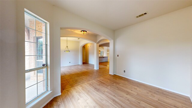 empty room with light hardwood / wood-style floors