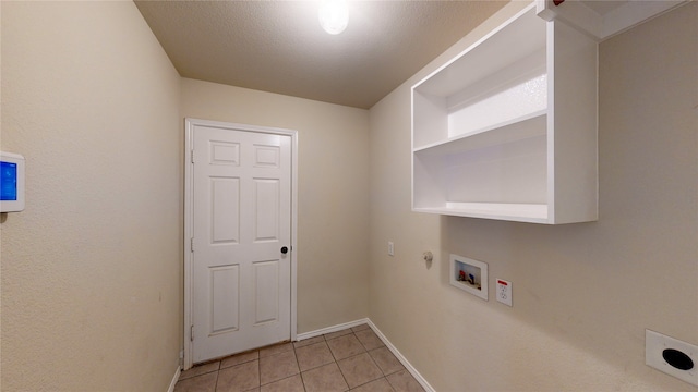 clothes washing area featuring washer hookup, a textured ceiling, electric dryer hookup, and light tile patterned floors