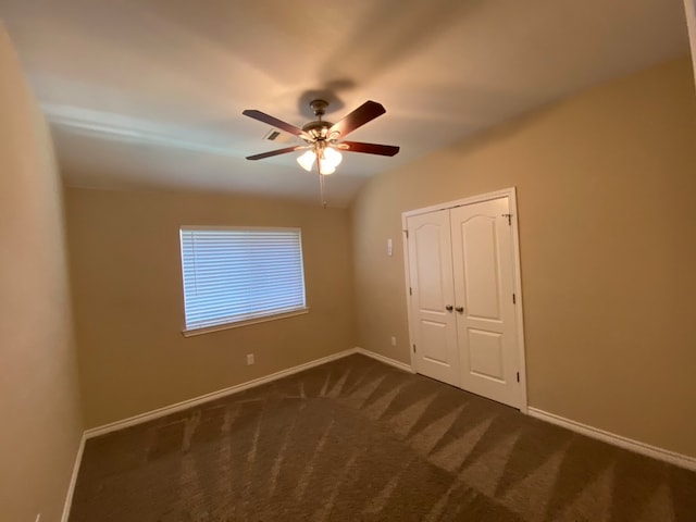 carpeted empty room with ceiling fan