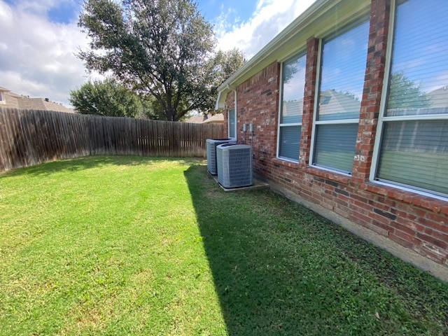 view of yard with central AC