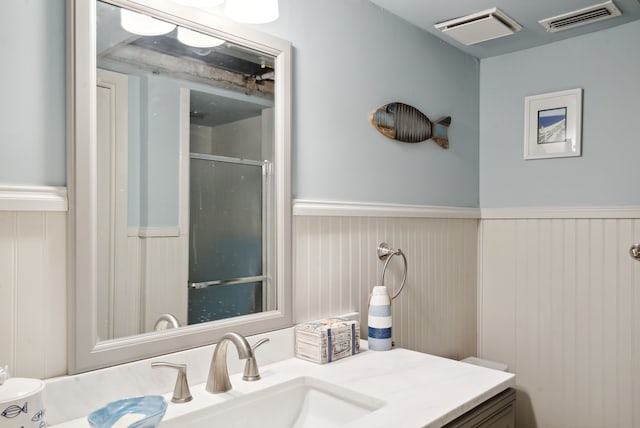 bathroom featuring vanity and walk in shower