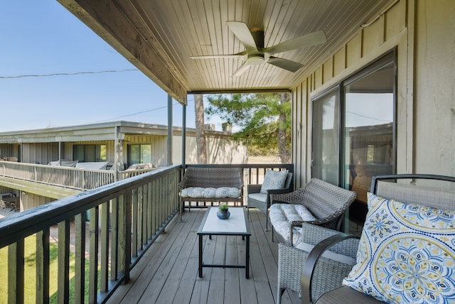 wooden deck featuring ceiling fan