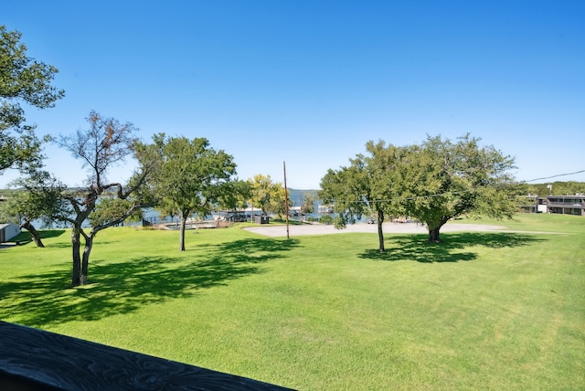 view of property's community with a lawn