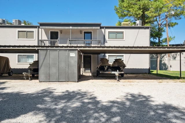 back of property with central AC unit