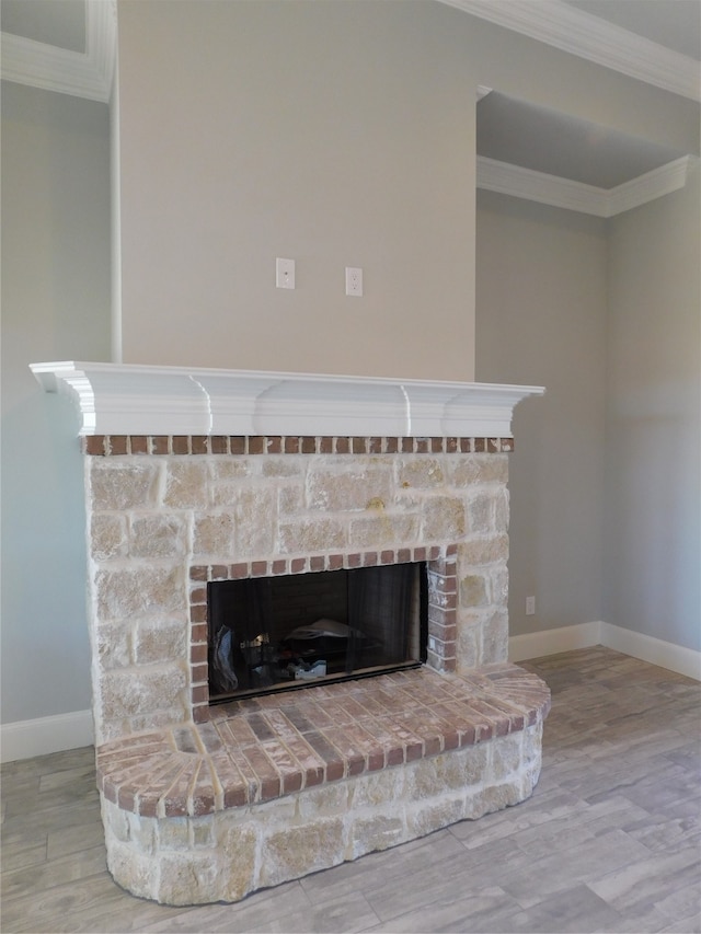 details featuring a fireplace, crown molding, and hardwood / wood-style floors