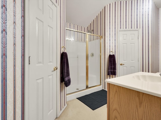 bathroom with vanity and an enclosed shower