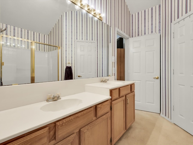 bathroom featuring vanity and an enclosed shower