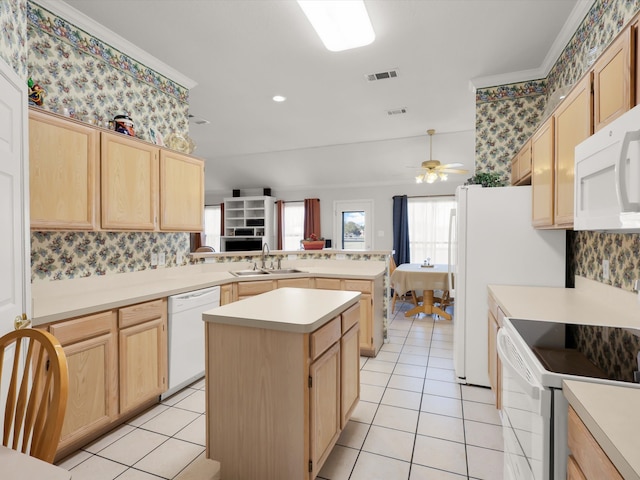 kitchen featuring a center island, sink, white appliances, light brown cabinets, and ceiling fan