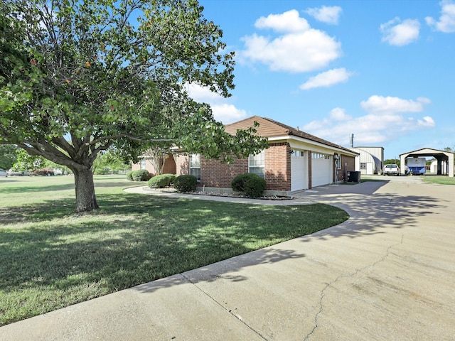 view of front of home with a front yard and a garage