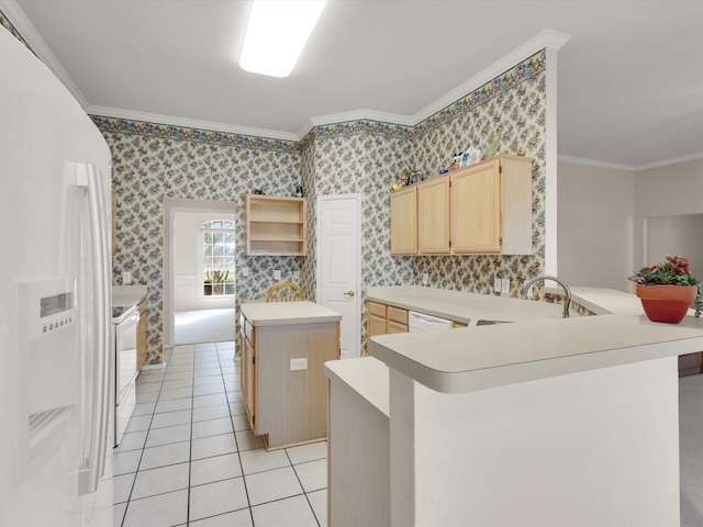 kitchen featuring ornamental molding, white appliances, kitchen peninsula, and a center island